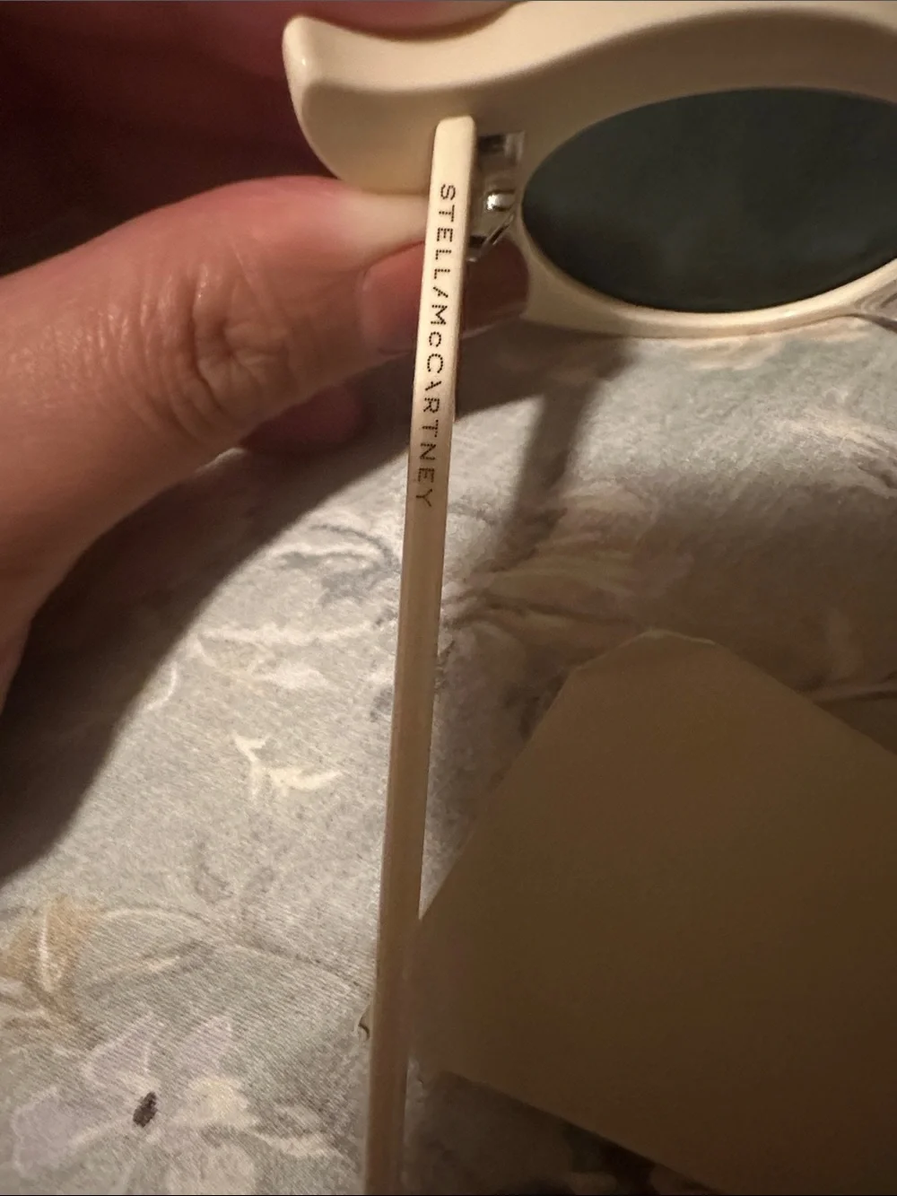 Stella McCartney Cream Swan Sunglasses with Black Lenses and Red Beak Accents